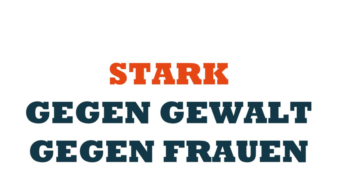 Plakat mit großer Schrift: "Stark gegen Gewalt gegen Frauen"